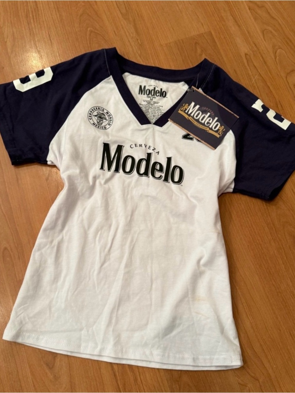 Brand New Modelo White V-Neck Tee with Navy Raglan Sleeves